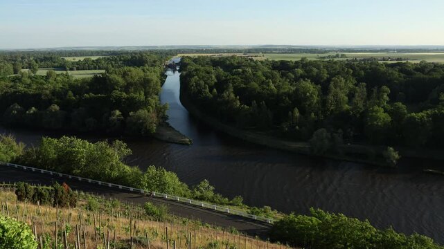 Scenic view of the confluence of the Vltava and Elbe (Labe) rivers near Měln&iacute;k Castle in the Czech Republic. Beautiful Central European landscape with flowing waterways, green riverbanks, historic sur