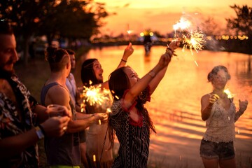 Fototapeta premium Joyful friends celebrating with sparklers.