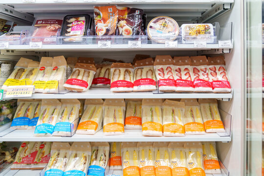 Tokyo, Japan - April 13, 2026: Selection of refridgerated sandwiches and snacks, including egg salad and strawberry cream sandos at a 7 Eleven konbini