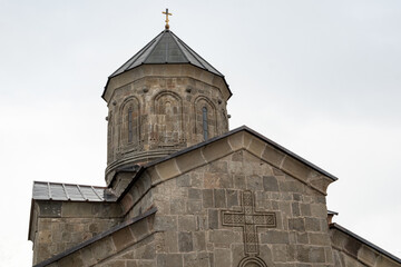 Naklejka premium The Gergeti Trinity Church is a stunning 14th-century Georgian Orthodox church perched on a 2,170-meter 