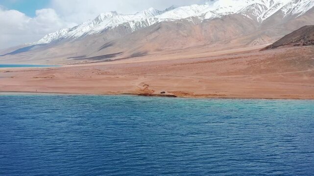 Aerial reveal of majestic blue Pangong Tso lake in Ladakh India. High Altitude Lake in Greater Himalayas