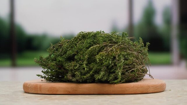 Green thyme bunch tied together, aromatic spices of dried thyme for use in cooking and folk medicine, herbal tea, kitchen. 
