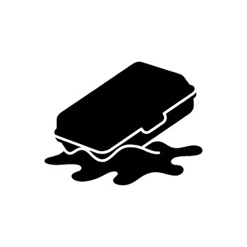 Black silhouette icon of a closed rectangular food container resting in a puddle of spilled liquid on a plain white background