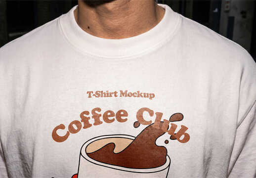 T-Shirt Front View Mockup On Person In Dark Urban Scene