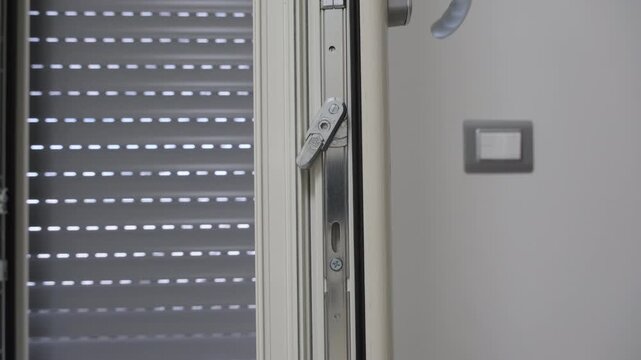 Window handle and shutter mechanism detail.