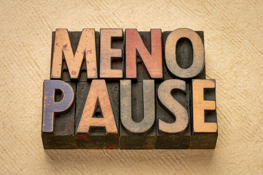 menopause word abstract in vintage wood letterpress printing blocks against bark paper