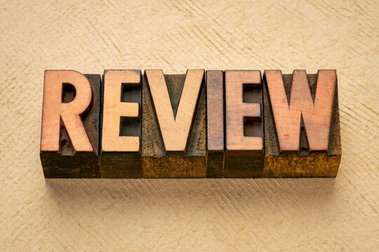 review word abstract in vintage letterpress wood type against textured art paper, business analysis, evaluation  and summary concept