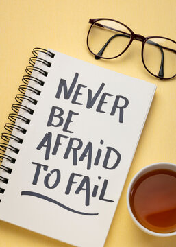 Never be afraid to fail - inspirational handwriting in a notebook