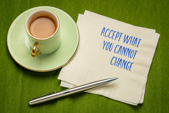 accept what you cannot change - inspirational note on a napkin with coffee