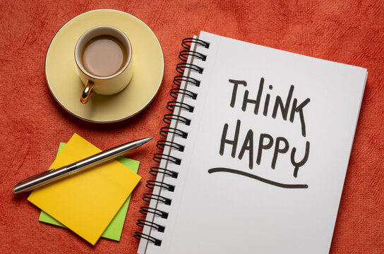 think happy inspirational handwriting in a notebook with a cup of coffee,  personal development, mindset, happiness and positivity concept