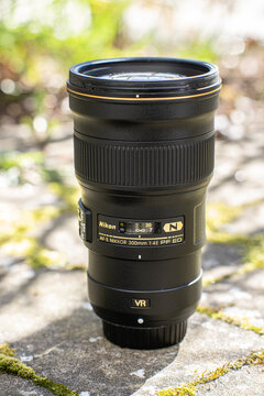 Gothenburg, Sweden - April 21 2024: nikon 300mm prime lens standing upright on sunlit stone surface.