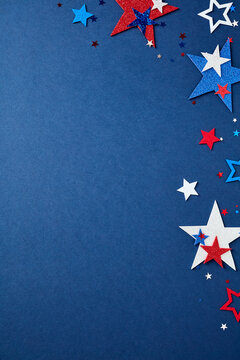 Vertical composition with red, white, and blue stars forming a border on the right side against a navy blue background. Patriotic design with copy space for USA holidays.