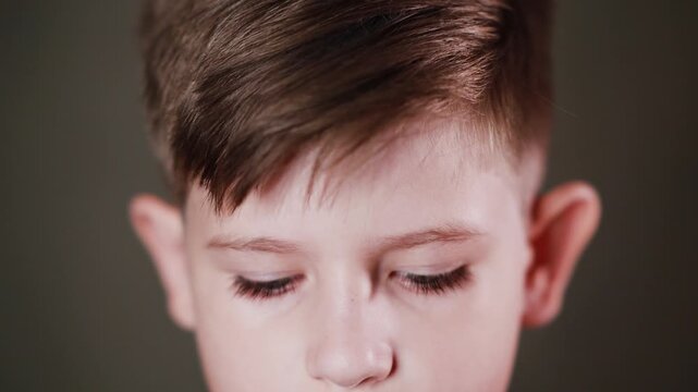 Emotional face of a boy, expression of different emotions