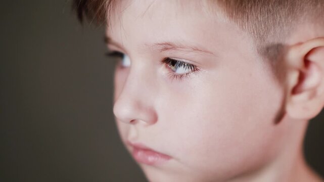 Emotional face of a boy, expression of different emotions