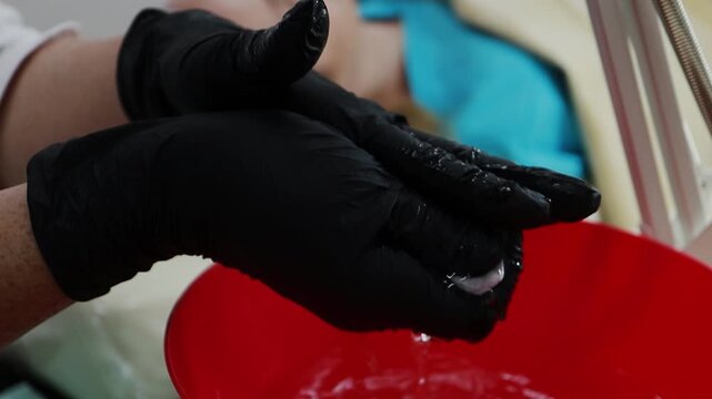 A female doctor, a professional cosmetologist, wets wipes