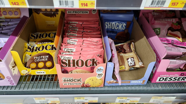 Protein Cookies and High Protein Snack Bars on Supermarket Shelf, Fitness Nutrition Products Editorial
