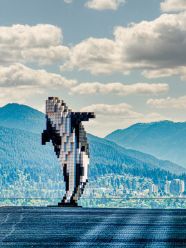 Douglas Coupland's Orca Sculpture at the Vancouver Convention Centre with North Shore Mountains, British Columbia