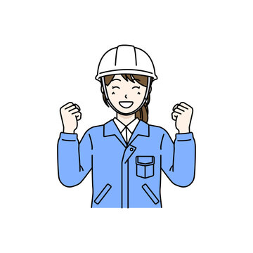 Female worker with safety helmet making a guts pose