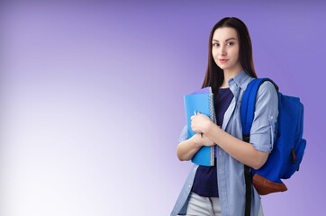 Fototapeta premium Happy young school student standing on background