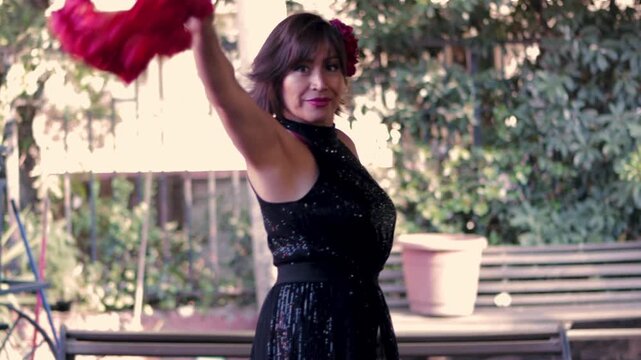 Beautiful mature woman with makeup and attitude, dancing the cueca brava. Dancing with style and waving her handkerchief. Typical Chilean dance, national dance of the national holidays.
