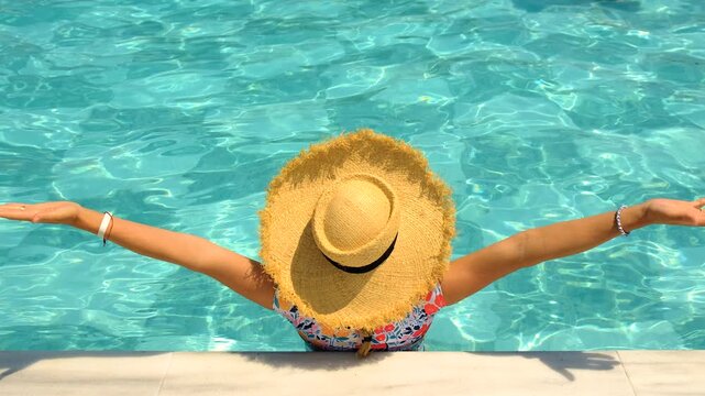Woman in hat in swimming pool. selective focus.