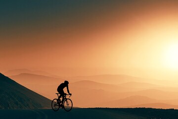 Obraz premium Lone Cyclist Riding a Mountain Pass at Hazy Dusk