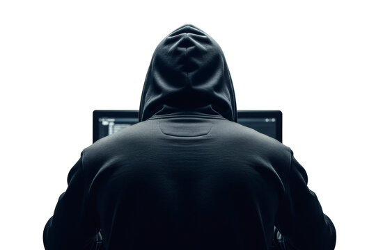 Back view of Silhouette of a person wearing a dark hooded sweatshirt sitting in front of a glowing computer screen coding or hacking&nbsp;&nbsp;