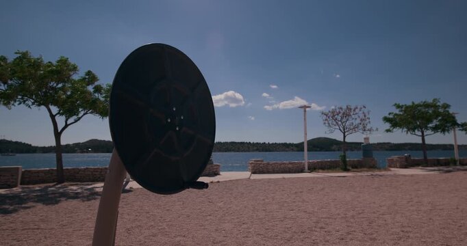 Outdoor exercise equipment in a waterfront fitness park in Sibenik, Croatia.