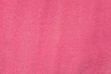 Fototapeta premium Pink textured background with soft fabric-like surface symbolizing creativity, femininity, modern design, elegant aesthetics, and decorative backdrop