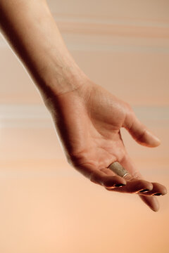 Hand against a warm background