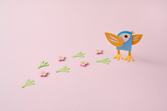 Paper spring craft bird with footprint trail