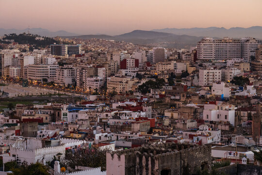 Densely populated city sprawling in open sky