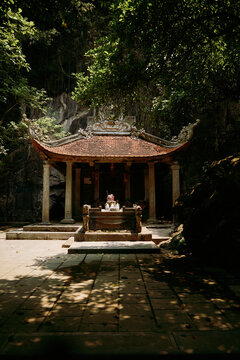 Exploring an ancient temple nestled in the lush forests of Vietnam