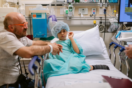 Family Waits Hospital Bed 