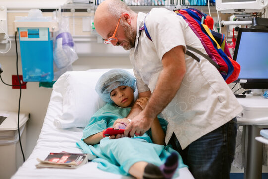 Holding Dad Hospital Bed Before Surgery