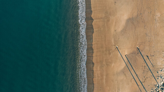Aerial shot of a sandy shore along the Welsh coast