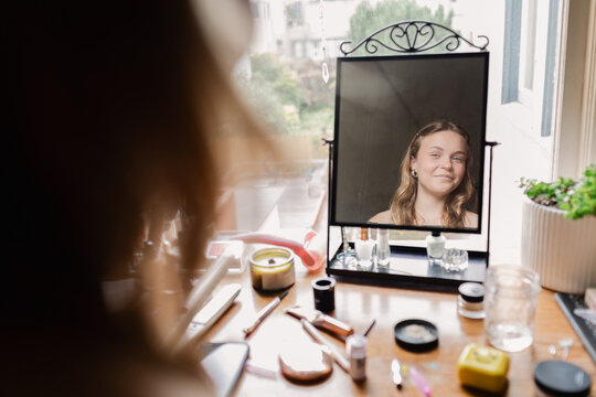 Looking Into Mirror Getting Ready