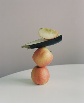 Still life with apples and half an aubergine.