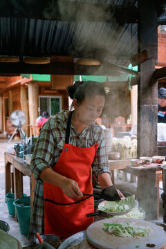Woman cooking a Thai Sukhothai-style Dry Noodles