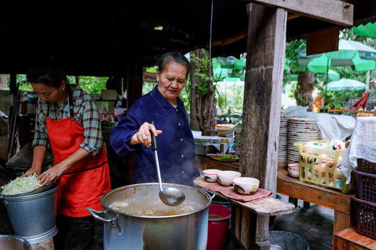 Women cooking Thai heritage dishes in a restaurant