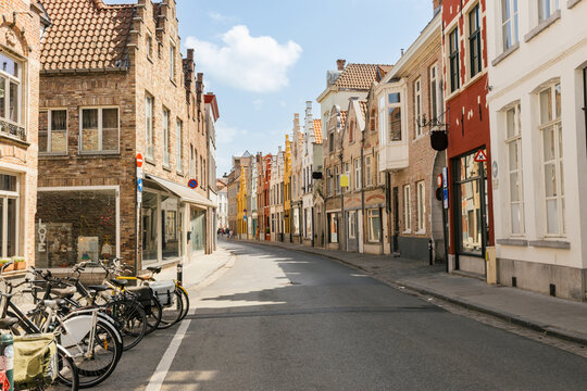 Charming Street Lined With Historic Buildings and Bicycles in the Sun