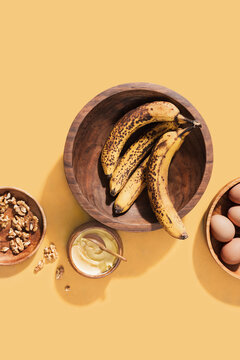 Ingredients to bake banana walnut bread or muffins