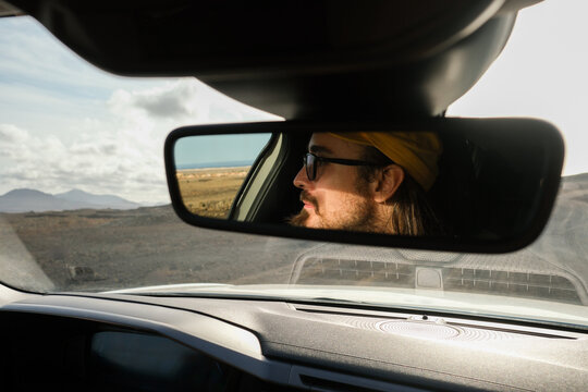 Driver Looking into Rearview Mirror