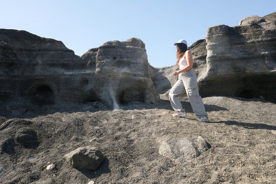 Woman Standing on Volcanic Formations