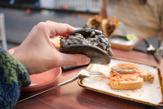 Hand holding bao bans