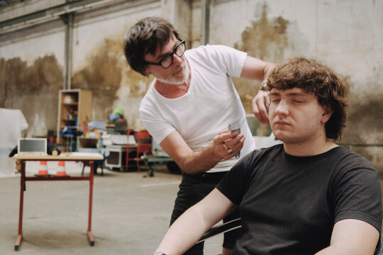 Barber Prepares Model in Creative loft Setting