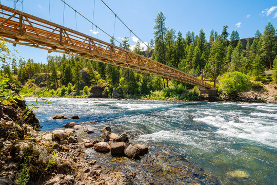 The wooden suspension bridge over the Spokane River at the Bowl and Pitcher area of Riverside State Park in Spokane, Washington, USA