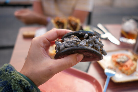 Hand holding bao bans