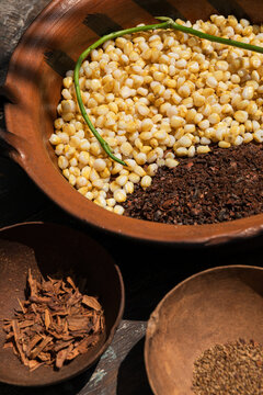 Corn and cinnamon in rustic pottery bowl