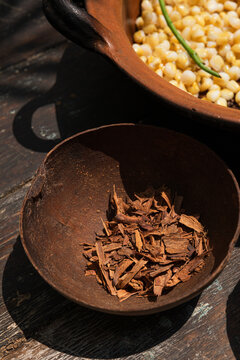 Closeup of cinnamon pieces in a rustic bowl